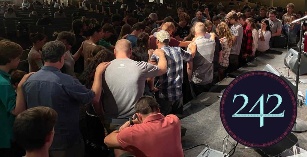 The church praying for the 242 group.